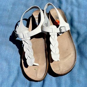 Cliff by white mountain sandals